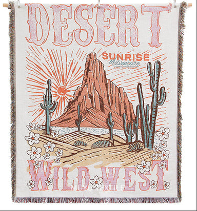 Woven blanket with desert and wild west design on a white background