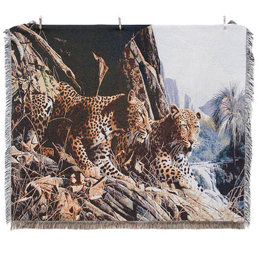Woven blanket with leopard design and brand logos on a white background