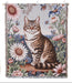 Woven blanket with a cat and floral design, featuring brand logos on a white background.